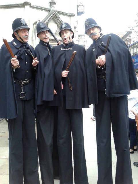 stilt walking policemen