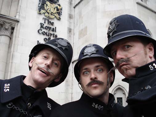 entertainers performing as victorian themed policemen