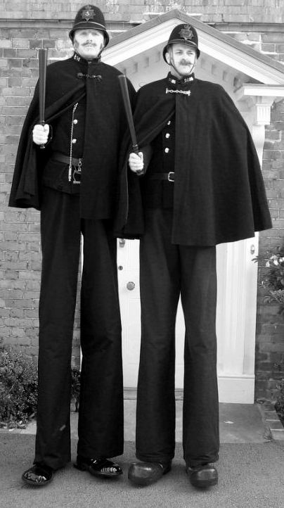 victorian / dickensian themed stilt walkers