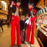 christmas themed stilt walkers