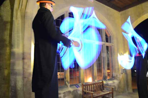 glow jugglers on stilts