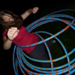 hula hooping girl at circus youth camp.
