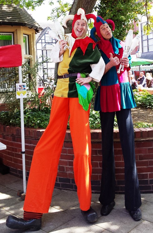 stilt walking jesters