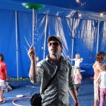 man plate spinning at festival