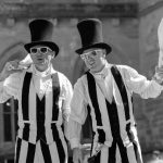 stripey stilt walkers, jugglers