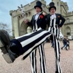 black & white stilt walkers