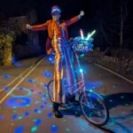 illuminated stilt bike entertainment