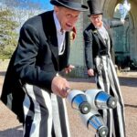 gentlemen jugglers on stilts