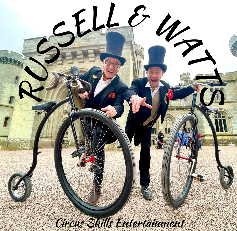 Circus skills entertainers. double act with penny farthings